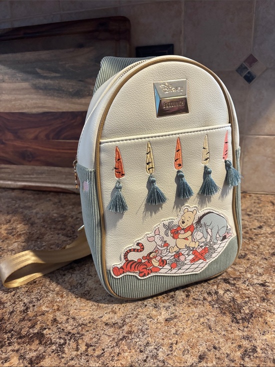 Boxlunch Handbags - NWOT Boxlunch Disney Cream & Sage Winnie the Pooh Tassel Mini Backpack